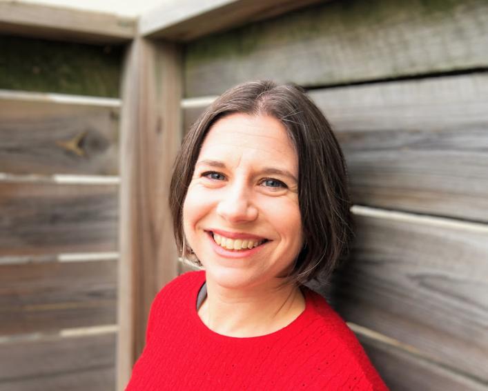 woman with red shirt and brown hair