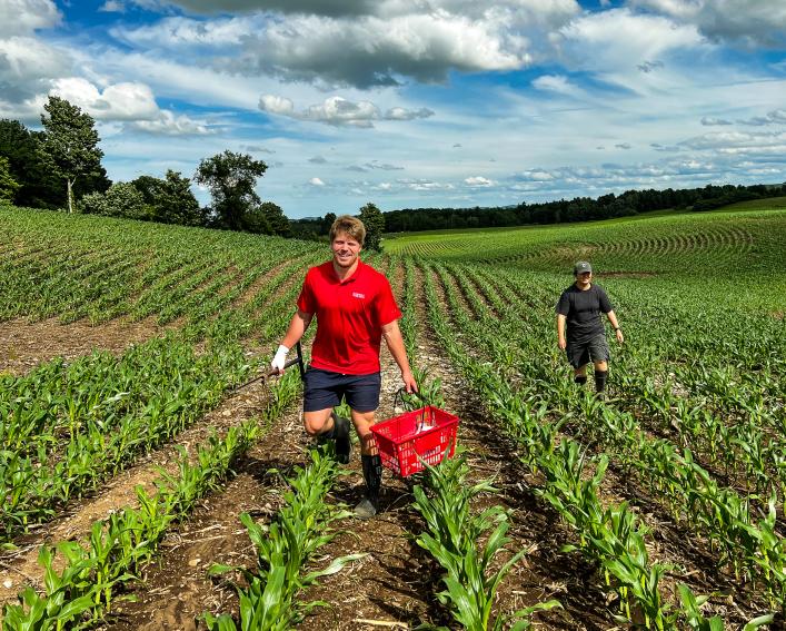 Nicholas Paschall walks in field
