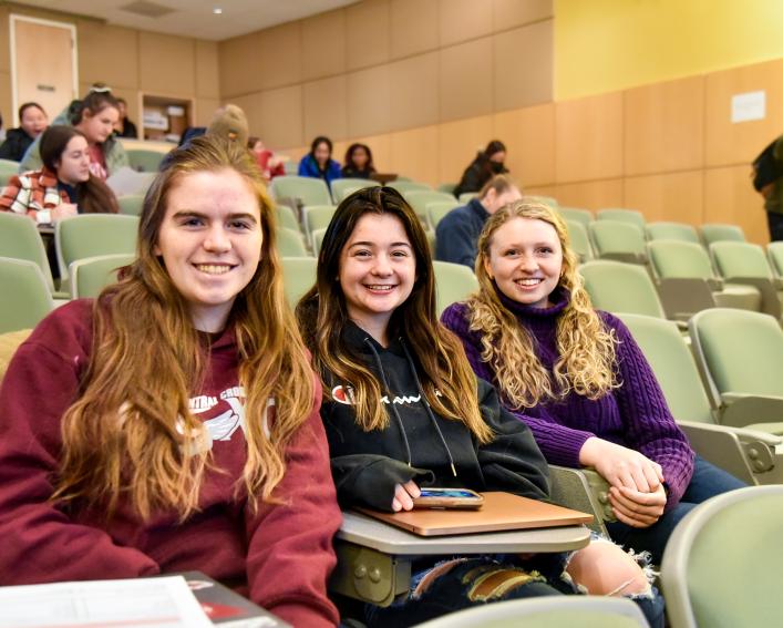 three young women smiling