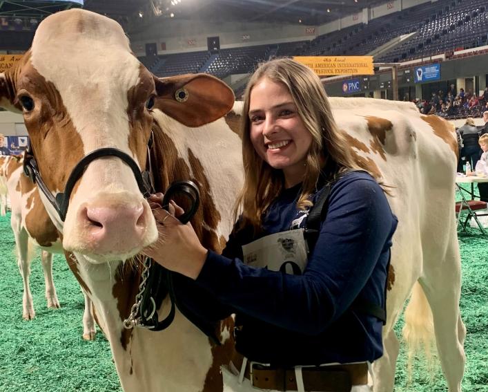 Emily Starceski showing a cow