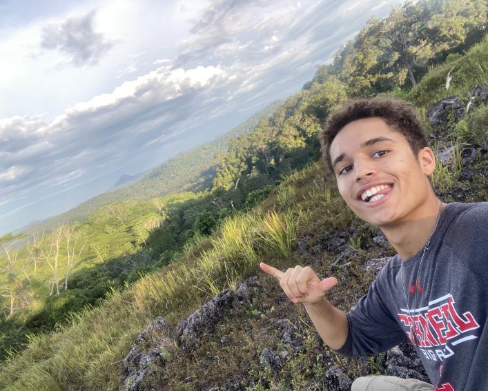 Person standing in front of mountain