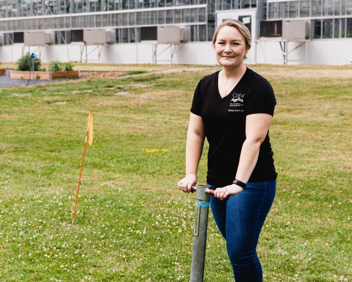 Ashley Jernigan poses with a soil extraction tool.