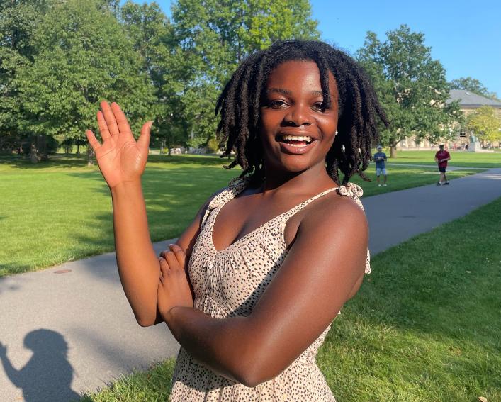 image of student waving