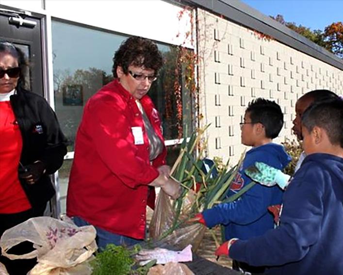 donna alese cooke working with young gardeners