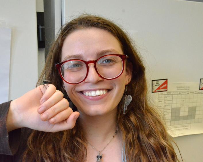 Hannah Tolz with a spotted lanternfly on her hand