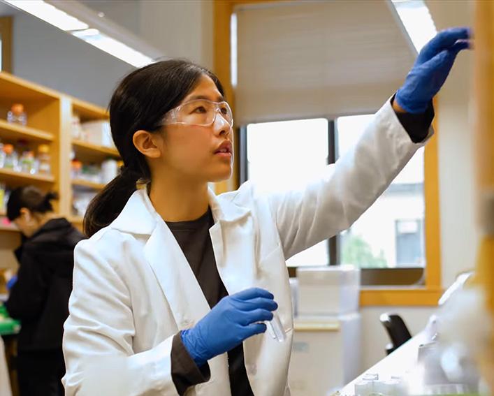 Xiaoying Gan in white lab coat