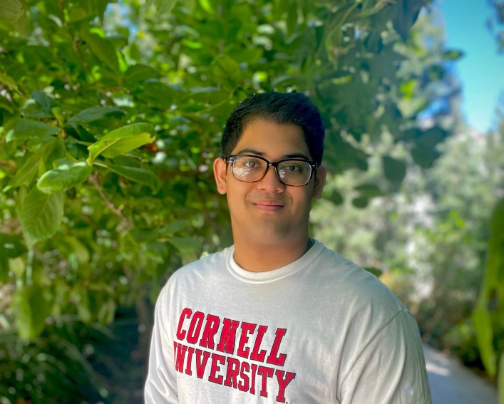 Photo of Takreem Ahmed in front of a tree