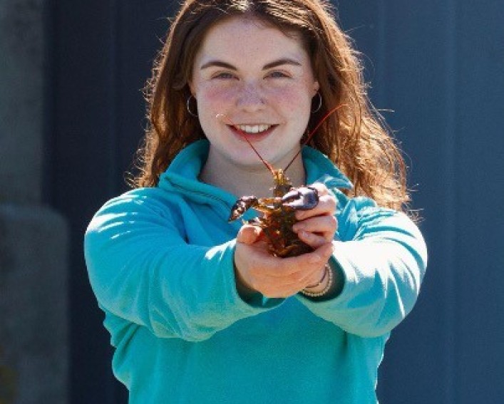 Girl holding a crab