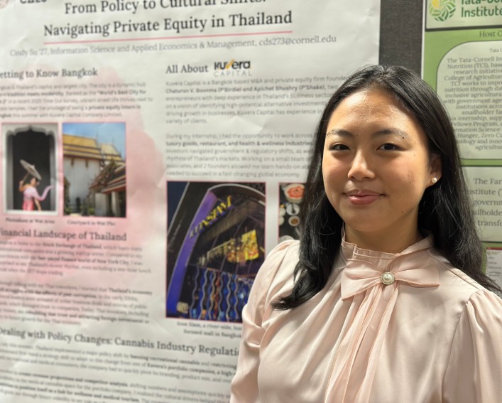 Cindy Su ’27 stands next to her poster.