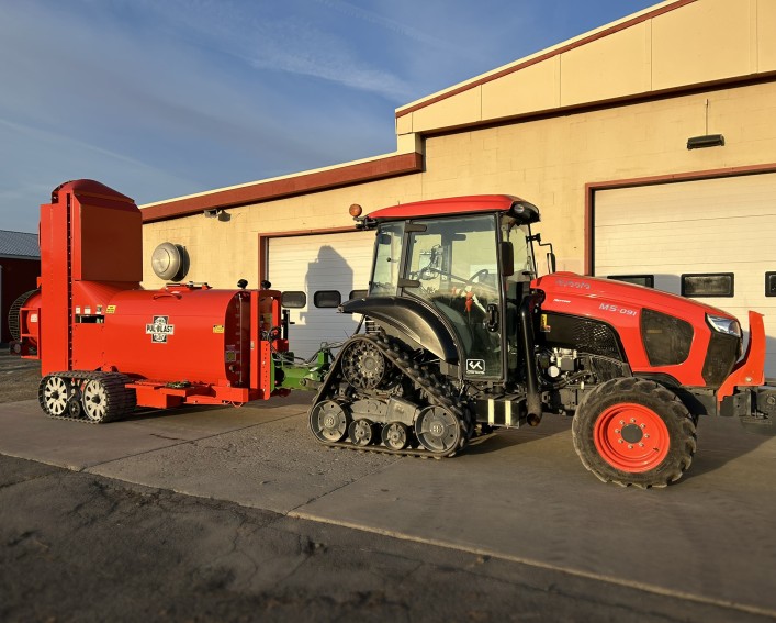 Large equipment - a tracked sprayer - at the Orchards