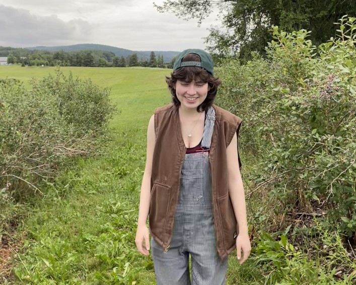 Masha walking on a grassy path