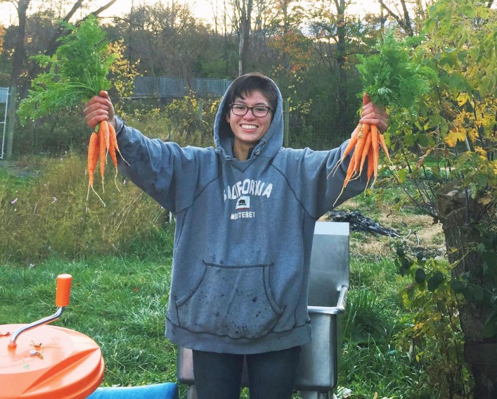 Samantha Hackett holding carrots
