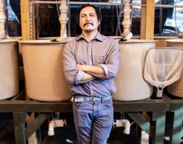 eugene won in front of aquaponic units