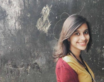 Woman standing in front of a wall