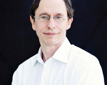 person in a white shirt standing