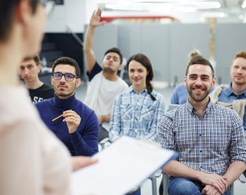 Students in class are being instructed by an instructor