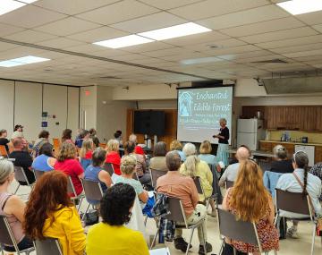 People in a room watching a presentation