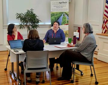 Four people seated around a table