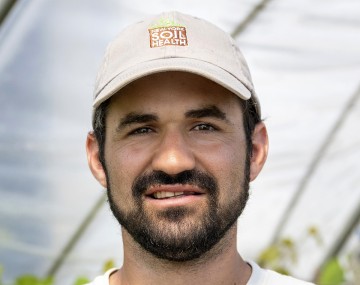 amsili headshot with soil health program cap
