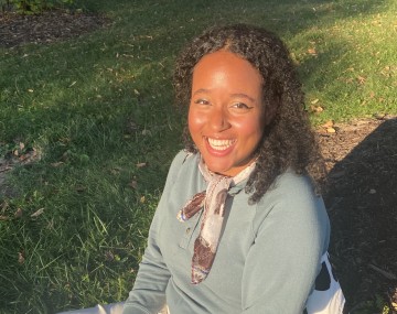 Girl smiling sitting on the grass