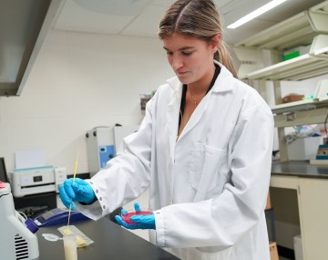 a woman works in a lab