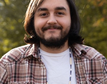 Nelson smiles at the camera.