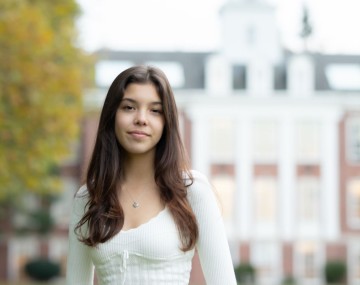Smiling woman in white top