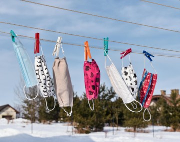 face masks hung to dry on the laundry line