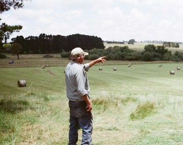Farmer overlooking fields
