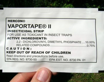 A sealed white packet of FAW insecticide about the size of an index card. The main text on the packet reads HERCON VAPORTAPE II. Inside the packet is a strip laced with insecticide for use in traps. 