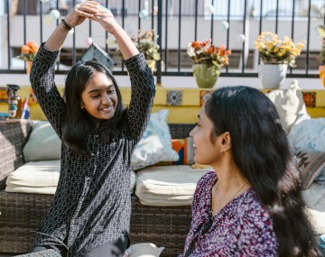 adult and teen interacting