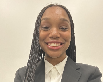 Smiling woman with black suit jacket