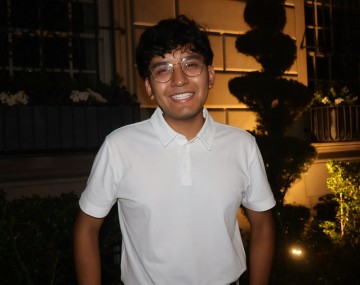 Smiling man in white shirt