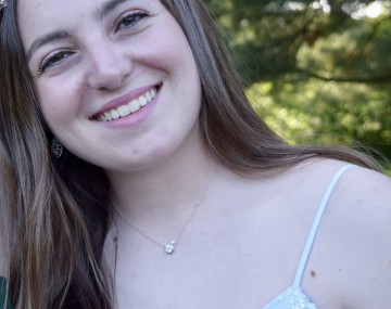 Smiling woman with head tilted to left