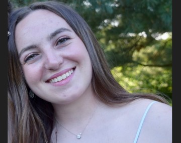 Smiling woman with head tilted