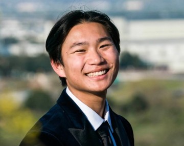 Smiling man with black suit jacket