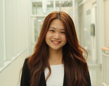Woman with suit in hallway