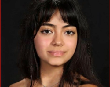 Smiling woman with off the shoulder black top