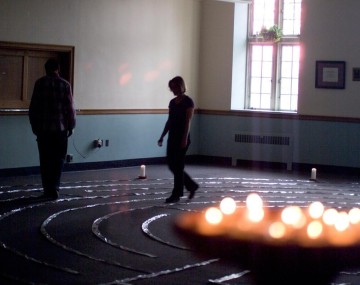 two figures walk around a meditation circle