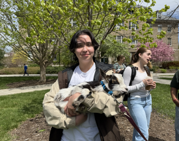 Mads on the Ag Quad holding a goat.