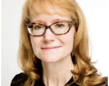 Woman wearing glasses and a black shirt