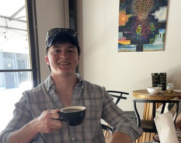 Person holding a beverage in their hand