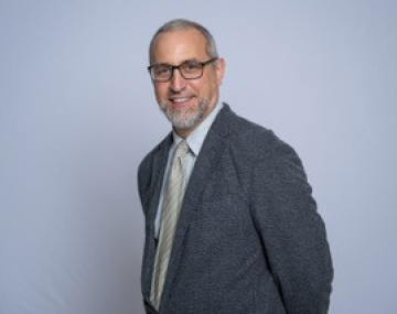 man in jacket with glasses